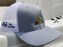 Redfish Zone, Khaki/White Trucker Mesh Snapback. With a Black, Copper & Blue Redfish Tail. With The Word Redfish Zone on both sides of the hat.